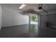 Two-car garage with epoxy flooring, insulated garage door and new lighting fixtures at 515 Allens Landing Ct, Lawrenceville, GA 30045