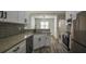 The kitchen features stainless steel appliances and granite countertops with breakfast bar at 515 Allens Landing Ct, Lawrenceville, GA 30045