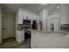 Modern kitchen features stainless steel appliances, granite countertops, and white cabinets at 515 Allens Landing Ct, Lawrenceville, GA 30045