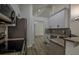 Bright, airy kitchen features stainless appliances, granite counters, and wood-look floors at 515 Allens Landing Ct, Lawrenceville, GA 30045