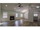 Open living room featuring hard wood floors, fireplace, and abundant natural light at 515 Allens Landing Ct, Lawrenceville, GA 30045