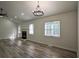 The open living room boasts a fireplace, plenty of natural light, and modern ceiling fan at 515 Allens Landing Ct, Lawrenceville, GA 30045
