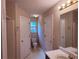 Neat bathroom featuring a vanity, toilet, and tile shower area at 7250 Bridgeport Ct, Austell, GA 30168