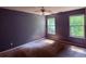 Cozy bedroom with natural light and a ceiling fan at 7250 Bridgeport Ct, Austell, GA 30168