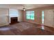 Spacious living room features fireplace and natural light from entry at 7250 Bridgeport Ct, Austell, GA 30168
