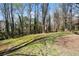 Picturesque backyard with mature trees, a verdant lawn, and a tranquil atmosphere, great for relaxation and recreation at 3937 Locklear Way, Atlanta, GA 30360