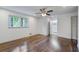 Primary bedroom includes hardwood floors, ceiling fan, and an ensuite bathroom at 3937 Locklear Way, Atlanta, GA 30360