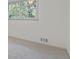 Bedroom features a window to backyard and neutral carpet at 3937 Locklear Way, Atlanta, GA 30360