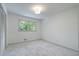 Cozy bedroom with plush carpet, ample natural light from large window, and spacious closet at 3937 Locklear Way, Atlanta, GA 30360