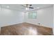 Spacious bedroom featuring hardwood floors, modern ceiling fan, and a large window at 3937 Locklear Way, Atlanta, GA 30360