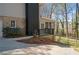 Exterior view of the home showcasing a screened in sunroom with wooden deck and a well-maintained yard at 3937 Locklear Way, Atlanta, GA 30360