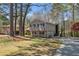 Exterior showcasing a charming two-story home with a brick base and siding, complete with an attached garage at 3937 Locklear Way, Atlanta, GA 30360