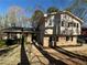 Charming two-story home featuring a brick facade, complemented by mature trees and a well-manicured front yard at 3937 Locklear Way, Atlanta, GA 30360