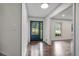 Bright foyer featuring hardwood floors and a glass front door, offering a welcoming entrance at 3937 Locklear Way, Atlanta, GA 30360