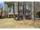 Traditional home with brick accents, dark shutters, and a lush green lawn at 3937 Locklear Way, Atlanta, GA 30360
