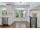 Bright kitchen and dining space featuring stainless appliances and views of wooded lot at 3937 Locklear Way, Atlanta, GA 30360