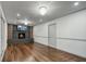 Hardwood floor living room featuring a cozy fireplace, and an open layout for entertaining guests at 3937 Locklear Way, Atlanta, GA 30360