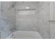 Detailed shot of shower featuring decorative tile and recessed shelf at 3937 Locklear Way, Atlanta, GA 30360