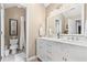 Bright bathroom with double vanity, modern fixtures, and a glass door shower providing a spa-like experience at 4967 Jett Rd, Marietta, GA 30066