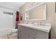 Bright bathroom featuring double vanity with framed mirror and shower-tub combination with stylish fixtures at 4967 Jett Rd, Marietta, GA 30066