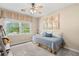 Bright bedroom features a daybed, natural light, ceiling fan, and hardwood floors at 4967 Jett Rd, Marietta, GA 30066