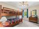 Cozy bedroom with bunk beds, ceiling fan, hardwood floors, and ample natural light at 4967 Jett Rd, Marietta, GA 30066