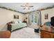 Well-lit bedroom with daybed, ceiling fan, hardwood floors, and a spacious closet at 4967 Jett Rd, Marietta, GA 30066