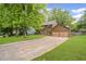 Spacious driveway leading to a well-maintained home with a two-car garage and a verdant lawn at 4967 Jett Rd, Marietta, GA 30066