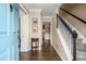 Welcoming foyer with hardwood floors, a staircase with white railings, and a blue front door at 4967 Jett Rd, Marietta, GA 30066