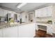 Well-lit kitchen featuring a large island and modern stainless steel appliances at 4967 Jett Rd, Marietta, GA 30066