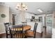 Bright kitchen with stainless appliances, white cabinets, granite countertops and hardwood floors at 4967 Jett Rd, Marietta, GA 30066