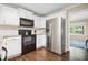 Bright kitchen featuring stainless steel appliances, white cabinetry, and a modern design at 4967 Jett Rd, Marietta, GA 30066