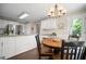 Bright kitchen with stainless appliances, granite countertops and hardwood floors with view to the backyard at 4967 Jett Rd, Marietta, GA 30066