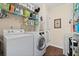 Functional laundry room includes modern washer and dryer, shelving and storage space at 4967 Jett Rd, Marietta, GA 30066