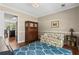 Cozy living room boasts hardwood floors, a decorative rug, and views to the kitchen at 4967 Jett Rd, Marietta, GA 30066