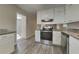 Modern kitchen featuring stainless steel appliances and stylish countertops at 586 Chris Cir, Lawrenceville, GA 30044