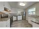 Updated kitchen featuring stainless steel appliances, granite countertops, and white cabinets at 586 Chris Cir, Lawrenceville, GA 30044