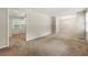 Bright living room featuring neutral paint, plush carpet, and ample space for entertaining guests at 586 Chris Cir, Lawrenceville, GA 30044