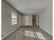 Open living area with neutral paint, new carpet, and ample natural light at 586 Chris Cir, Lawrenceville, GA 30044