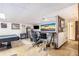 Finished basement with a bar area, seating, TV, refrigerator, and a view of the door at 6230 S Summers S Cir, Douglasville, GA 30135