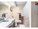 Clean bathroom with a vanity, toilet, shower with curtain, and decorative storage options at 6230 S Summers S Cir, Douglasville, GA 30135