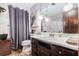 Bathroom featuring a single sink vanity, toilet, mirror, and gray curtains at 6230 S Summers S Cir, Douglasville, GA 30135