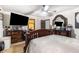 Comfortable bedroom showcasing a ceiling fan, a well-placed TV, and plenty of drawer storage at 6230 S Summers S Cir, Douglasville, GA 30135