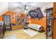 Bright bedroom with a tanning bed, eclectic decor, ceiling fan and track lighting, and light patterned carpeting at 6230 S Summers S Cir, Douglasville, GA 30135
