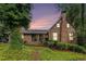 Charming brick home featuring a chimney and covered front porch, nestled in a lush, green landscape at 6230 S Summers S Cir, Douglasville, GA 30135