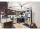 Functional kitchen features stainless steel appliances, dark cabinetry and a window with natural light at 6230 S Summers S Cir, Douglasville, GA 30135