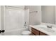 Bathroom with single vanity, bathtub and shower with white fixtures at 829 Overlook Path Ln, Lawrenceville, GA 30045