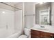 Bathroom with single vanity, bathtub and shower at 829 Overlook Path Ln, Lawrenceville, GA 30045