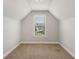 Small room with carpet and window showing trees and houses at 829 Overlook Path Ln, Lawrenceville, GA 30045