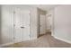 Cozy bedroom with neutral walls, carpet flooring, and closet with double doors at 829 Overlook Path Ln, Lawrenceville, GA 30045